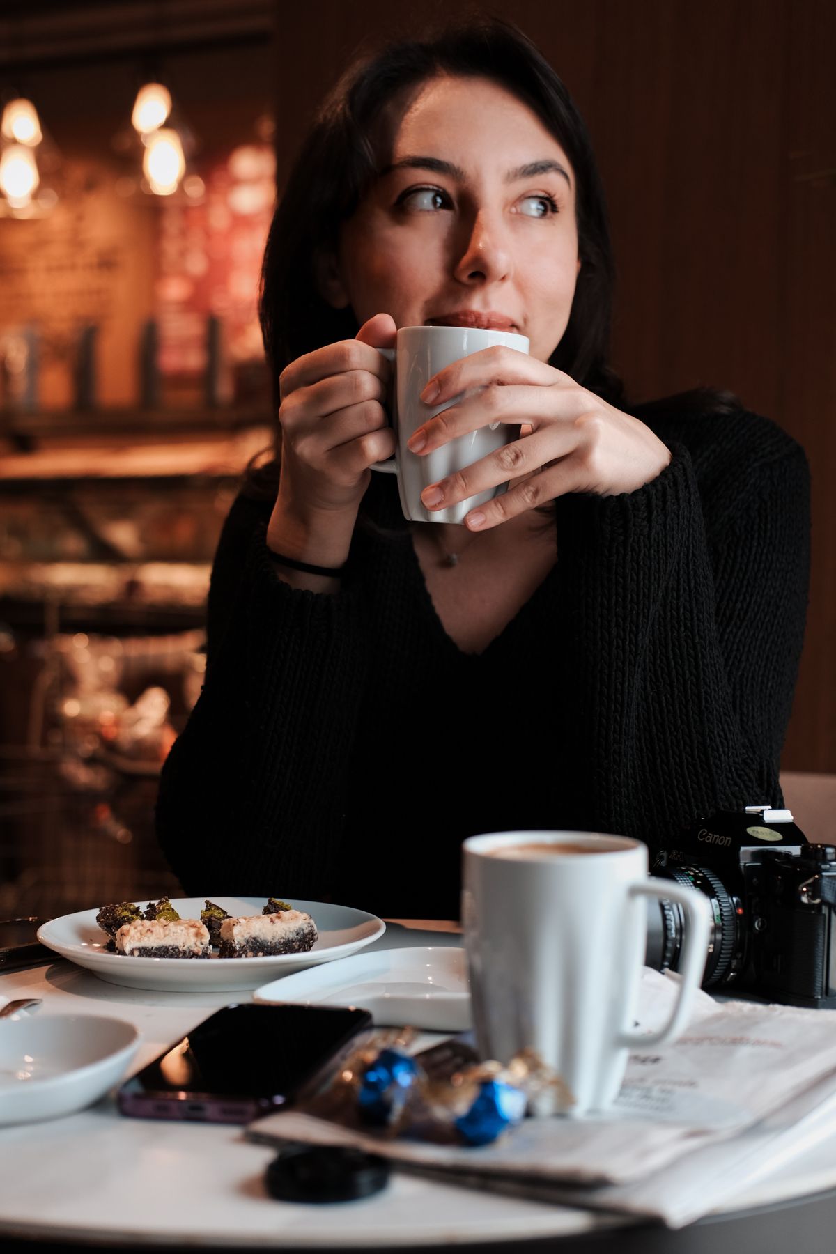 A professional taking a calm moment away from work with a coffee